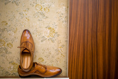 Close-up of shoes on table at home