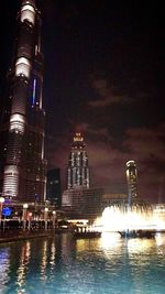 Low angle view of illuminated city at night