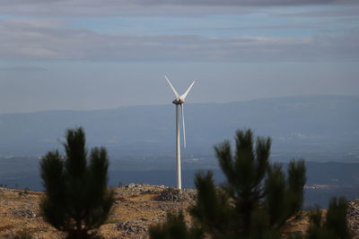 Wind turbine against sky