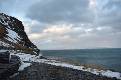 Scenic view of sea against sky during winter