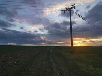 Scenic view of field against sky during sunset