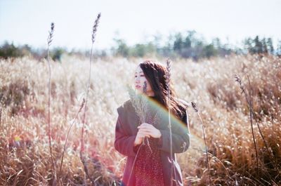 Woman standing on field