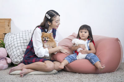 Friends sitting on wall