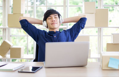 Mid adult man using mobile phone