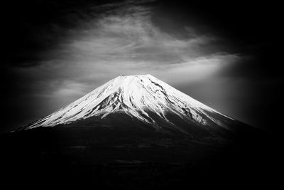 Scenic view of snowcapped mountain against sky