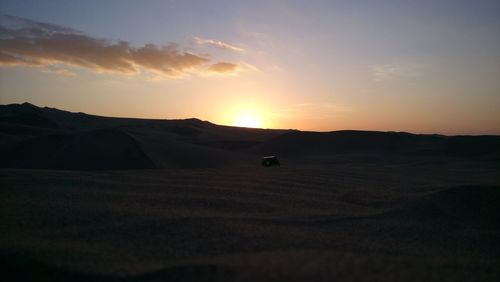 Scenic view of silhouette landscape against sky during sunset