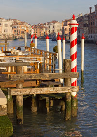 Pier over sea against buildings in city