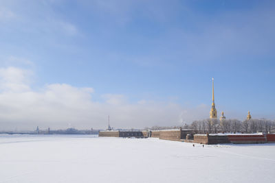 View of buildings against sky during winter