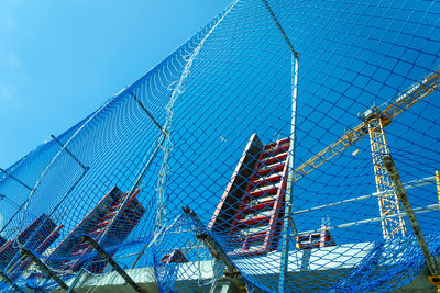 Low angle view of buildings against clear blue sky