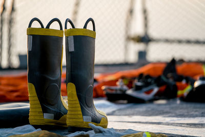 Close-up of shoes on street