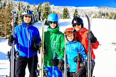 Portrait of people standing in snow