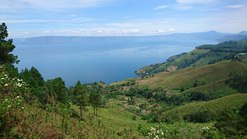 Scenic view of landscape and mountains against sky