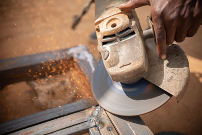 Zambian welder, welding , african man working with his hands 