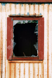 Broken window of old building