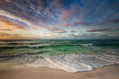 Scenic view of sea against sky during sunset