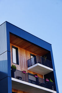 Low angle view of building against clear blue sky