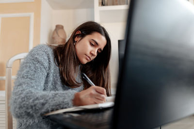 Young woman using mobile phone