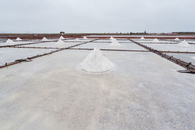 Jingzaijiao tile paved salt fields with dry salt ready for harvesting in cloudy weather in tainan city in taiwan