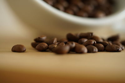 Close-up of coffee beans on table