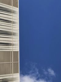 Low angle view of modern building against clear blue sky