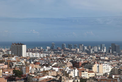High angle view of buildings against sky in city