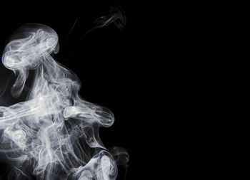 Close-up of smoke against black background