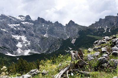 Scenic view of mountains against cloudy sky