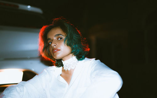 Portrait of young woman looking away