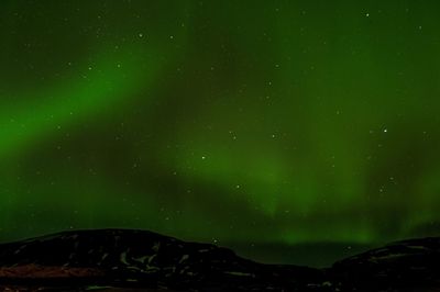 Low angle view of mountain against sky at night