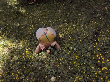 High angle view of woman exercising over plants