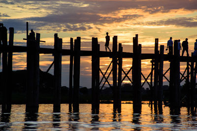 Silhouette bridge during sunset