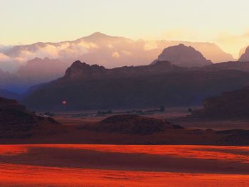 Scenic view of mountains at sunset