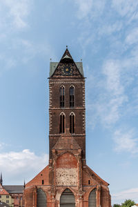 The tower of st mary church in historic centre of wismar, germany.