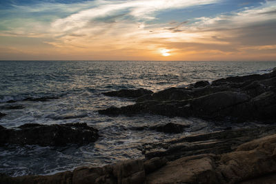 Scenic view of sea against sky during sunset