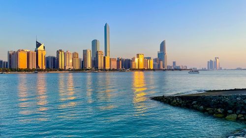 Sea with buildings in background