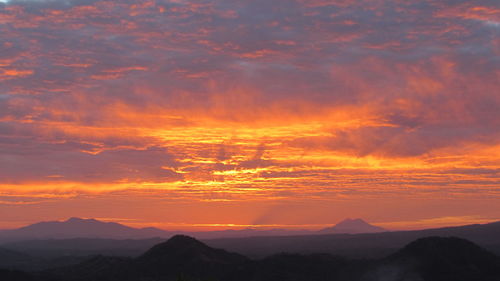 Scenic view of dramatic sky during sunset