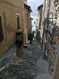 Narrow alley amidst buildings in town