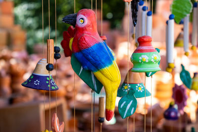 Close-up of wooden bird for sale in market
