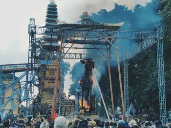 People in temple against sky