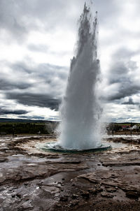 Water splashing against sky