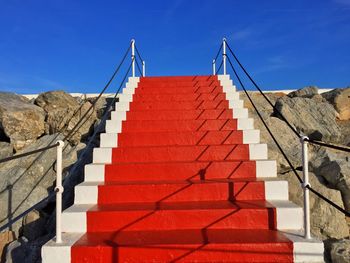 Red steps against blue sky
