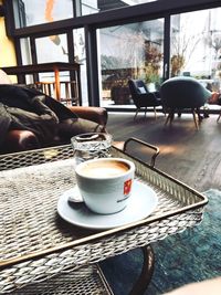 Close-up of coffee cup on table