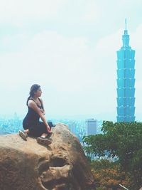 Full length of woman standing in city