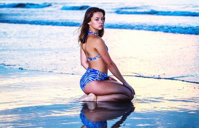 Young woman in bikini on beach