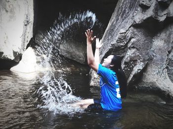 Boy playing in water