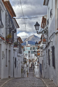 Narrow street amidst buildings in town