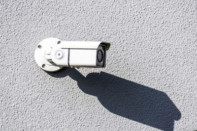 Close-up of hand photographing camera