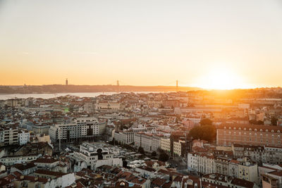 High angle view of city at sunset