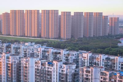 High angle view of buildings in city against sky