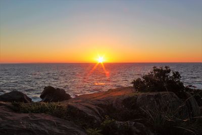 Scenic view of sea against sky during sunset